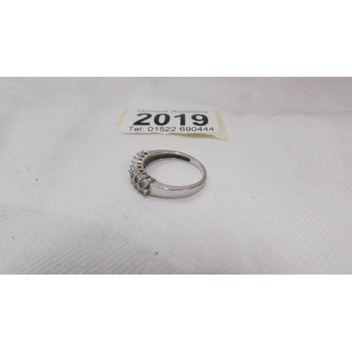 2019 - A diamond double row band ring set with 16 diamonds in 9ct white gold, size O.