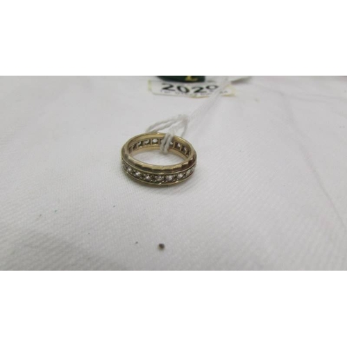 2029 - A 9ct gold white stone set band ring, early to mid 20th century, size K.