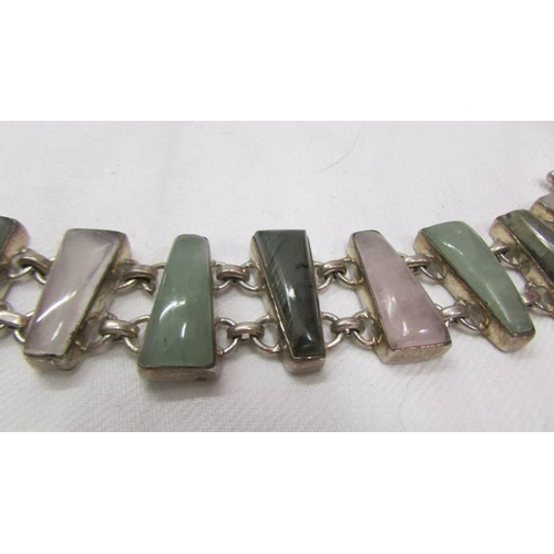 2034 - A multi stone set bracelet in silver, rose quartz, agate etc.,