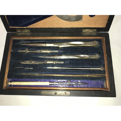 1137 - An Edwardian mahogany cased geometry set