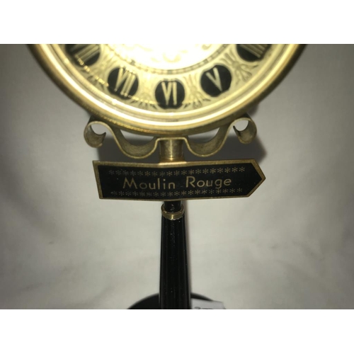 1143 - A vintage Rhythm alarm clock in form of a Moulin Rouge street lamp