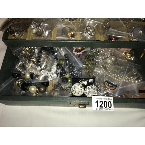 1200 - A green jewellery box with an assortment of costume jewellery