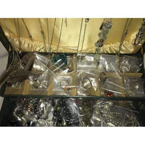 1200 - A green jewellery box with an assortment of costume jewellery