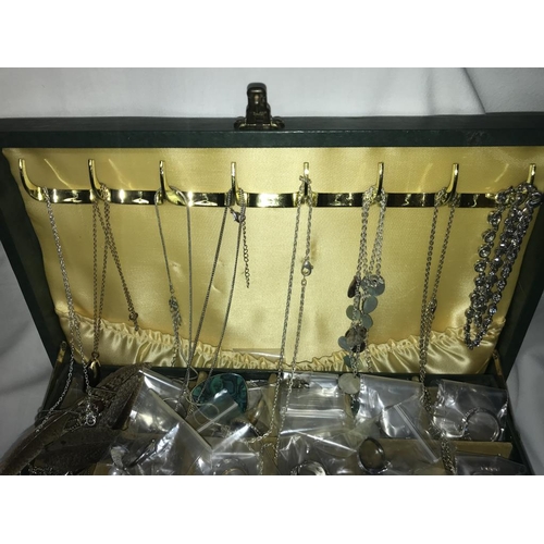 1200 - A green jewellery box with an assortment of costume jewellery