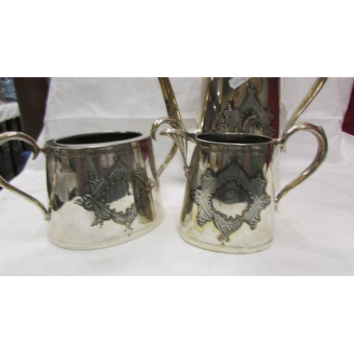 2052 - A three piece silver plate tea set.