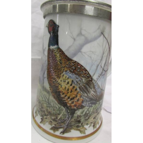 2058 - A Franklin Mint limited edition porcelain 'The Game Bird' Stein, 18cm tall.