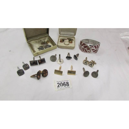 2068 - A good lot of cuff links, tie clips, silver ring and bangle.