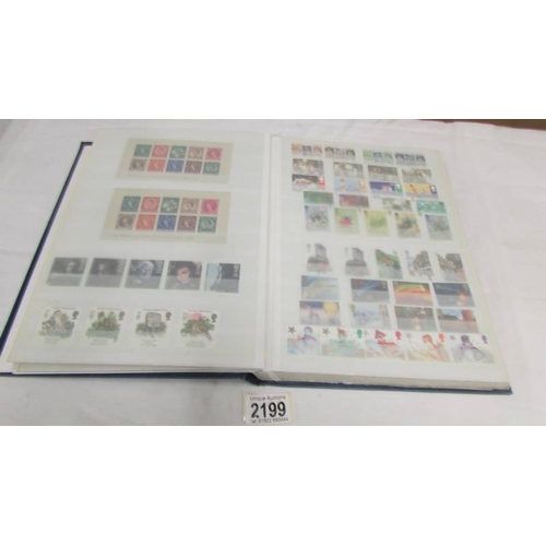 2199 - A good album of mint definitive stamps and sets (some in strips, many with gutter sides), approximat... 