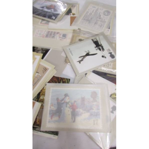 2201 - In excess of 200 assorted postcards, stamped envelopes etc.,