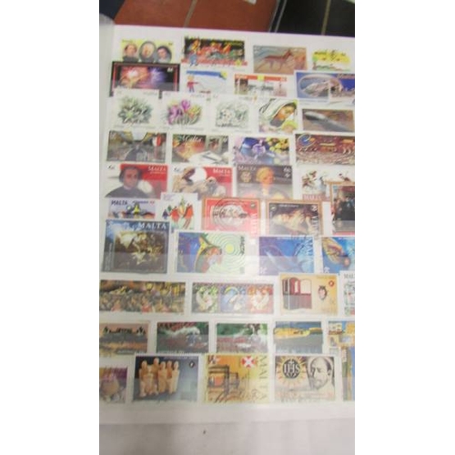 2207 - Five albums of world stamps including UK, New Zealand, Australia, Magyar, Nigeria, Lesotho, South Af... 