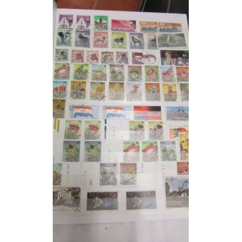 2207 - Five albums of world stamps including UK, New Zealand, Australia, Magyar, Nigeria, Lesotho, South Af... 