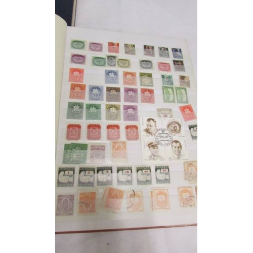 2207 - Five albums of world stamps including UK, New Zealand, Australia, Magyar, Nigeria, Lesotho, South Af... 