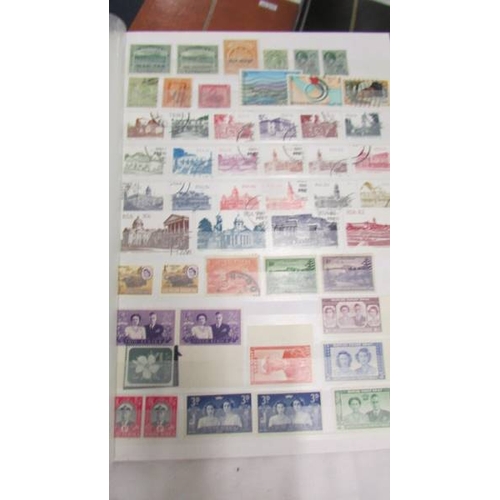 2207 - Five albums of world stamps including UK, New Zealand, Australia, Magyar, Nigeria, Lesotho, South Af... 