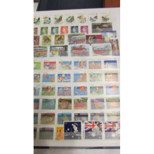 2207 - Five albums of world stamps including UK, New Zealand, Australia, Magyar, Nigeria, Lesotho, South Af... 