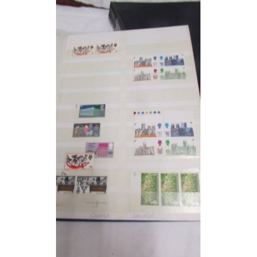 2209 - Three folders and a part album of UK stamps.