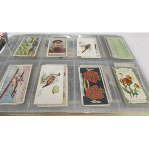 2215 - An album of late 19th/early 20th cigarette cards including Will's, Player's, Ogden's, Carreras etc.,... 