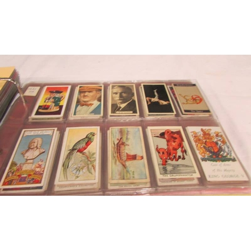 2215 - An album of late 19th/early 20th cigarette cards including Will's, Player's, Ogden's, Carreras etc.,... 