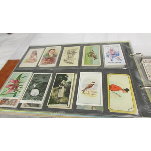 2215 - An album of late 19th/early 20th cigarette cards including Will's, Player's, Ogden's, Carreras etc.,... 