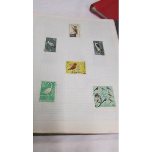 2216 - Four folders of assorted world stamps.