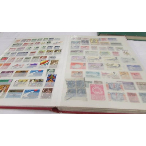 2218 - Three albums of assorted world stamps.