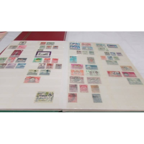 2218 - Three albums of assorted world stamps.