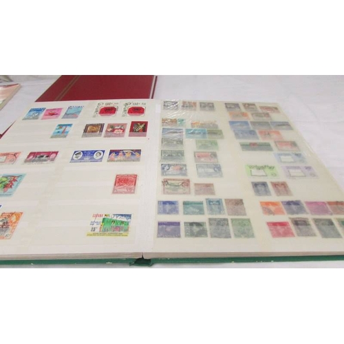 2218 - Three albums of assorted world stamps.