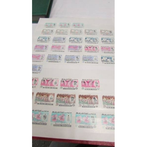 2219 - Three albums of UK and world stamps including Victorian penny reds.