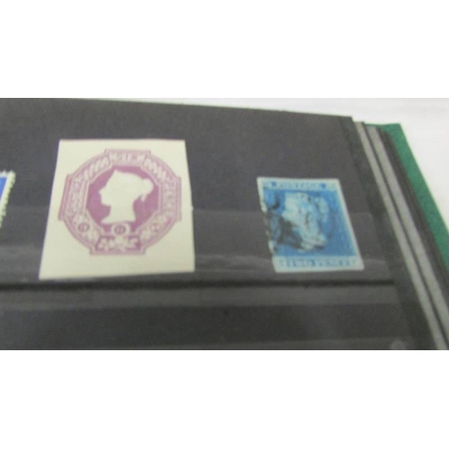 2219 - Three albums of UK and world stamps including Victorian penny reds.