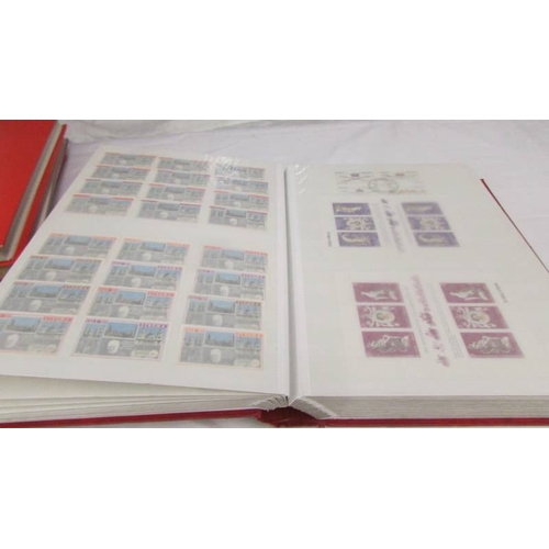 2221 - Four albums of world stamps including Poland, Iraq, USA, Australia, Fiji, Samoa, Vietnam, Malta, Bru... 