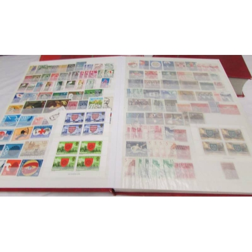 2221 - Four albums of world stamps including Poland, Iraq, USA, Australia, Fiji, Samoa, Vietnam, Malta, Bru... 