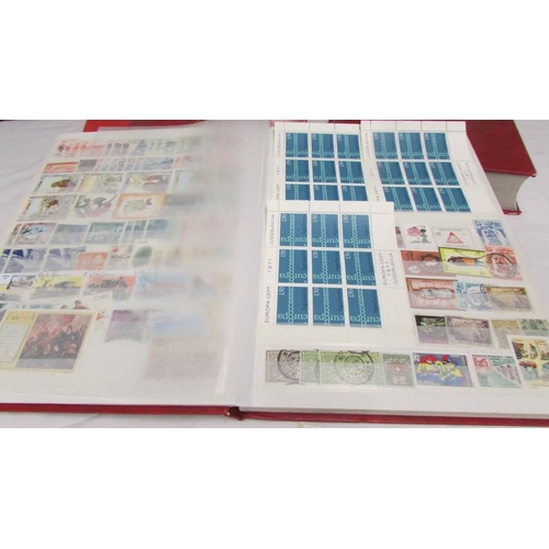 2221 - Four albums of world stamps including Poland, Iraq, USA, Australia, Fiji, Samoa, Vietnam, Malta, Bru... 