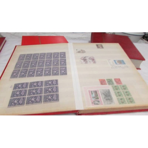 2221 - Four albums of world stamps including Poland, Iraq, USA, Australia, Fiji, Samoa, Vietnam, Malta, Bru... 