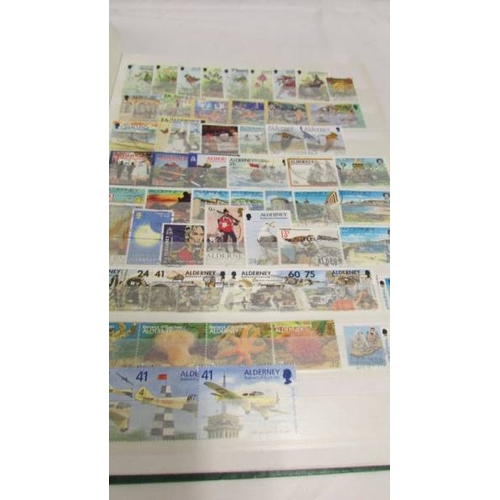 2224 - Two albums of UK and Channel Islands stamps including Victorian penny reds, a Victorian two penny bl... 