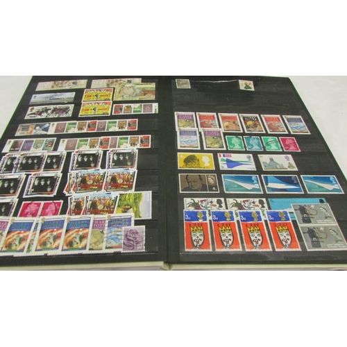 2225 - Two albums and a folder of UK and Channel Islands stamps.