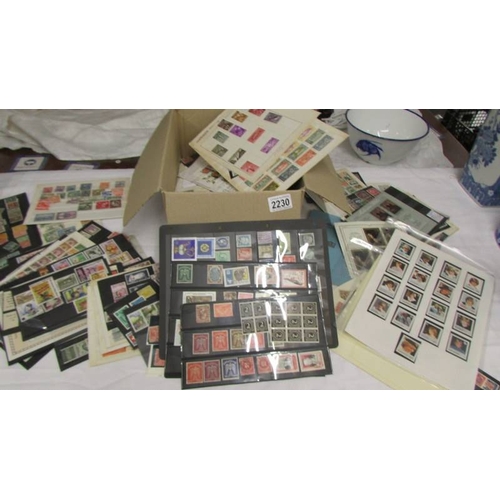 2230 - A box of assorted foreign stamps including Nicaragua, France, South Africa, Bhutan, Morocco, Bermuda... 