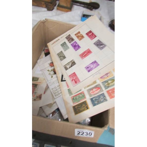 2230 - A box of assorted foreign stamps including Nicaragua, France, South Africa, Bhutan, Morocco, Bermuda... 