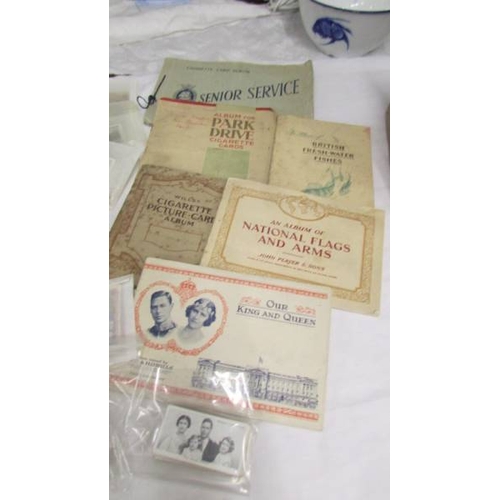 2232 - A mixed lot of cigarette cards (some in albums) including Senior Service, Player's, Will's, Park Dri... 