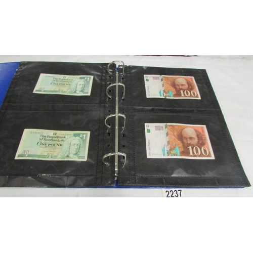 2237 - An album of bank notes including UK £1, UK 10/-, USA, Japan, Germany, France, Malaya etc.,