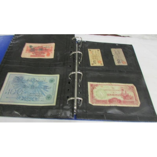 2237 - An album of bank notes including UK £1, UK 10/-, USA, Japan, Germany, France, Malaya etc.,