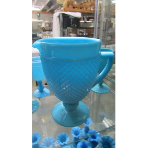 2249 - A blue glass jug and five goblets.