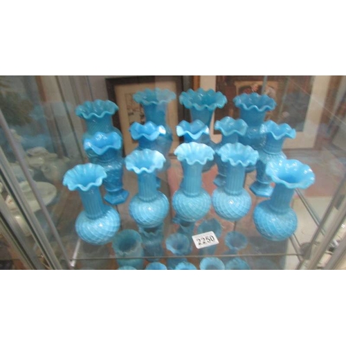 2250 - Approximately 30 blue glass vases in various styles, (2 shelves). (Collect only).