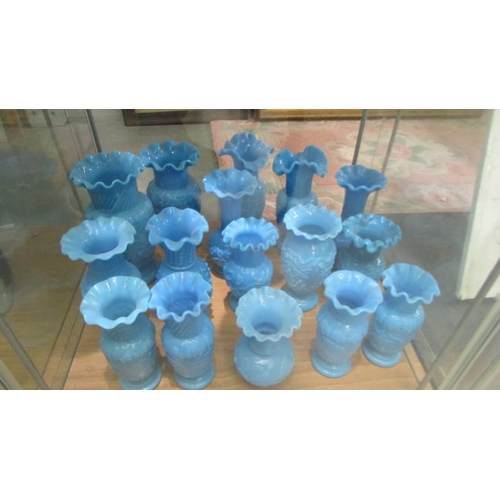 2250 - Approximately 30 blue glass vases in various styles, (2 shelves). (Collect only).