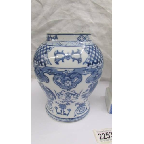 2253 - A blue and white jar (missing top).