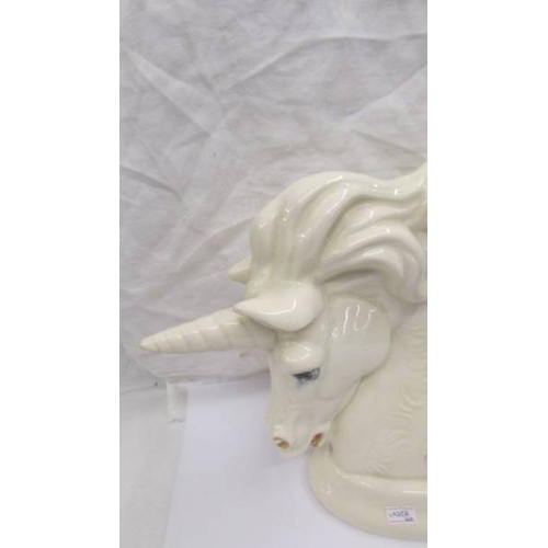 2260 - A Kruger sculpture, hand made in Cornwall Unicorn, signed S T K, 26cm high.