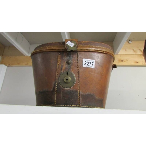 2277 - An old leather top hat case.