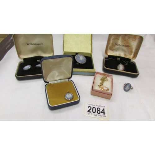 2084 - Three Wedgwood pendants, a Wedgwood brooch, a pair of Wedgwood earrings and a Wedgwood ring.