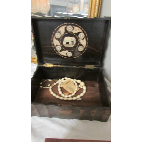 2281 - A Victorian rosewood box with elephant inlay inside lid.