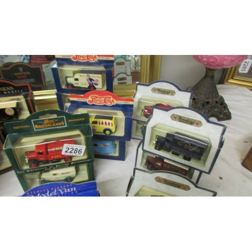 2286 - In excess of 30 boxed die cast trade vehicles including Dr Pepper, Pepsi, Guinness etc.,