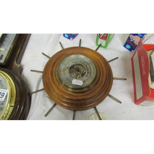 2289 - An oak barometer/thermometer in good condition together with another barometer (cracked glass)