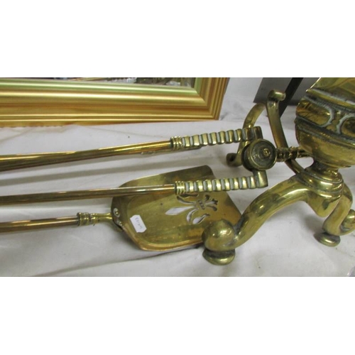 2292 - A pair of heavy brass Victorian fire dogs together with a set of 3 brass fire irons, (shovel, poker ... 